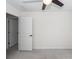 A bright bedroom with neutral carpet, white walls and trim, and an open door to the hallway at 103 Rosa Gray Ln, Goose Creek, SC 29445