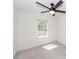 A bright bedroom with neutral carpet, white walls, a ceiling fan and a window with view to the outside at 103 Rosa Gray Ln, Goose Creek, SC 29445