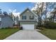 Charming home with a two-car garage, well-maintained lawn, and inviting curb appeal at 103 Rosa Gray Ln, Goose Creek, SC 29445