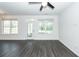 Bright and airy living room with luxury vinyl plank flooring, ceiling fan, and ample natural light at 103 Rosa Gray Ln, Goose Creek, SC 29445