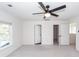 Large bedroom featuring a window, ceiling fan, neutral carpet and doorways to other rooms at 103 Rosa Gray Ln, Goose Creek, SC 29445