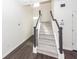 Carpeted staircase with white risers and dark wood handrail at 103 Rosa Gray Ln, Goose Creek, SC 29445