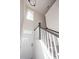 Carpeted staircase with white risers, wood handrail and a front door at 103 Rosa Gray Ln, Goose Creek, SC 29445