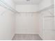 A walk-in closet featuring neutral carpet and metal shelving at 103 Rosa Gray Ln, Goose Creek, SC 29445