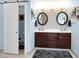 Bathroom features a double vanity with granite counters, round mirrors, and a separate toilet area at 1067 Shipton Ct, Charleston, SC 29414
