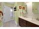 Bathroom with double sinks, tile flooring, and decorative coastal themed accents at 1067 Shipton Ct, Charleston, SC 29414