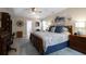 Spacious bedroom features a tray ceiling, ceiling fan, plush carpet, and lots of windows at 1067 Shipton Ct, Charleston, SC 29414