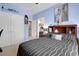 Bedroom with blue walls, closet, and artwork above headboard at 1067 Shipton Ct, Charleston, SC 29414