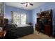 Bedroom with blue walls, a ceiling fan, and desk area by the window at 1067 Shipton Ct, Charleston, SC 29414