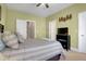Bedroom with a ceiling fan, open doors and views of an entertainment center at 1067 Shipton Ct, Charleston, SC 29414