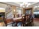 Spacious dining room featuring hardwood floors, a large table, and a view of the staircase at 1067 Shipton Ct, Charleston, SC 29414