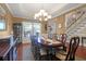 Elegant dining room with a chandelier, large table, and views of the entry and staircase at 1067 Shipton Ct, Charleston, SC 29414