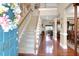 Grand two-story foyer featuring hardwood floors, a staircase, and ample natural light at 1067 Shipton Ct, Charleston, SC 29414