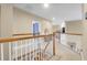 Upstairs hallway with wood railings, neutral carpet and views to a bathroom and other rooms at 1067 Shipton Ct, Charleston, SC 29414