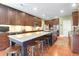 Spacious kitchen features a large island with seating, stainless appliances, and hardwood floors at 1067 Shipton Ct, Charleston, SC 29414