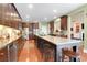 Spacious kitchen features a large island with seating, stainless appliances, and hardwood floors at 1067 Shipton Ct, Charleston, SC 29414