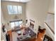 Spacious living room with hardwood floors, high ceilings, fireplace, and comfortable seating at 1067 Shipton Ct, Charleston, SC 29414