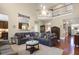 Cozy living room featuring hardwood floors, high ceilings, a ceiling fan and a comfortable sectional sofa at 1067 Shipton Ct, Charleston, SC 29414