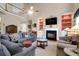 Spacious living room featuring tall ceilings, a fireplace, and comfortable seating arrangement at 1067 Shipton Ct, Charleston, SC 29414