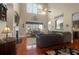 Comfortable living room with tall ceilings, a fireplace, hardwood floors, and plenty of seating at 1067 Shipton Ct, Charleston, SC 29414