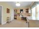 Office with custom cabinets, a desk, large window, and neutral decor at 1067 Shipton Ct, Charleston, SC 29414