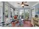 Bright sunroom with lots of natural light, tile floors, ceiling fan and access to the outside deck at 1067 Shipton Ct, Charleston, SC 29414
