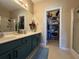 Stylish bathroom featuring a large vanity, modern fixtures and walk-in closet at 111 Spanish Oak Ln, Ladson, SC 29456