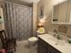 Bathroom featuring a shower with patterned curtain, a sink, and a storage unit at 111 Spanish Oak Ln, Ladson, SC 29456