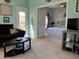 Bedroom with ceiling fan, and view into living room with sofa and TV at 111 Spanish Oak Ln, Ladson, SC 29456