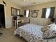 Bedroom with carpet, bed with blue quilt, desk, and windows offering lots of natural light at 111 Spanish Oak Ln, Ladson, SC 29456