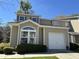 Charming tan home with an attached garage and neatly trimmed front yard at 111 Spanish Oak Ln, Ladson, SC 29456