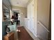 Inviting hallway featuring neutral tones, decorative accents, and a glimpse into the adjacent room at 111 Spanish Oak Ln, Ladson, SC 29456