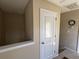 Upstairs hallway with carpeted floors and convenient access to storage space at 111 Spanish Oak Ln, Ladson, SC 29456