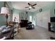 Cozy living room featuring a ceiling fan, comfortable sofa and neutral carpet at 111 Spanish Oak Ln, Ladson, SC 29456
