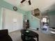 Bright living room features tile entryway, carpet, and view to staircase at 111 Spanish Oak Ln, Ladson, SC 29456