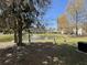 A beautiful view of a pond featuring a fountain with community housing in the background at 111 Spanish Oak Ln, Ladson, SC 29456