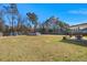 Expansive backyard with a pool, playset, covered patio with a dining table at 112 Lois Cir, Moncks Corner, SC 29461