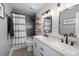 Well-lit bathroom features a double vanity, shower, bath tub, and decorative mirrors at 112 Lois Cir, Moncks Corner, SC 29461
