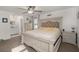 Bright bedroom features an ensuite bathroom, decorative ceiling fan and natural light at 112 Lois Cir, Moncks Corner, SC 29461