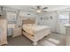 Serene bedroom with a large bed, ceiling fan, and soft natural light at 112 Lois Cir, Moncks Corner, SC 29461