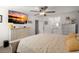 Bright bedroom features a large TV, decorative ceiling fan and an ensuite bathroom at 112 Lois Cir, Moncks Corner, SC 29461