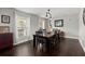 Inviting dining room boasts hardwood floors and natural light from two large windows at 112 Lois Cir, Moncks Corner, SC 29461