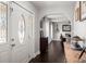 Inviting foyer featuring hardwood floors and an arched doorway leading to the dining room at 112 Lois Cir, Moncks Corner, SC 29461