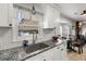Kitchen featuring stainless steel sink, granite counters, and a view to the backyard at 112 Lois Cir, Moncks Corner, SC 29461