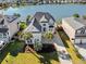 A beautiful waterfront property with palm trees, with water views and stunning home exterior at 1124 Clearspring Dr, Charleston, SC 29412