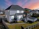Exterior view of home featuring a screened porch, deck, palm tree, and canal at 1124 Clearspring Dr, Charleston, SC 29412
