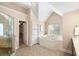 Bright bathroom with chandelier, large glass shower, soaking tub, and double vanity at 1124 Clearspring Dr, Charleston, SC 29412