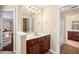 Bathroom featuring dark wood cabinets, marble countertops, tile floors and a vanity at 1124 Clearspring Dr, Charleston, SC 29412