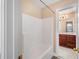 Bathroom featuring a tiled tub and shower combo and dark wood cabinets with a marble countertop at 1124 Clearspring Dr, Charleston, SC 29412