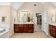 Double vanity in bathroom with custom cabinets, soaking tub and access to walk in shower at 1124 Clearspring Dr, Charleston, SC 29412